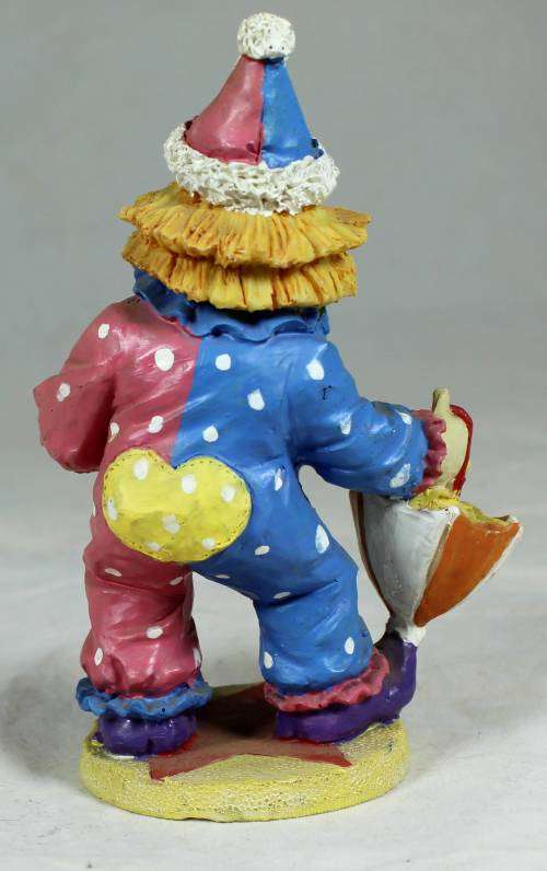Clown with flowers and umbrella
