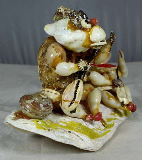 Fishing of the rocks shell sculpture