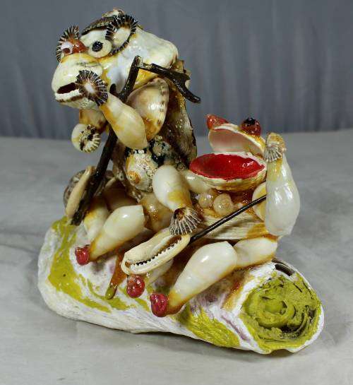 Fishing of the rocks shell sculpture