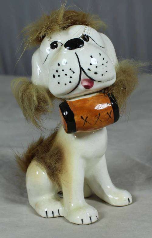 Porcelain dog with a beer keg