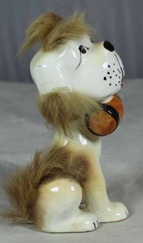 Porcelain dog with a beer keg