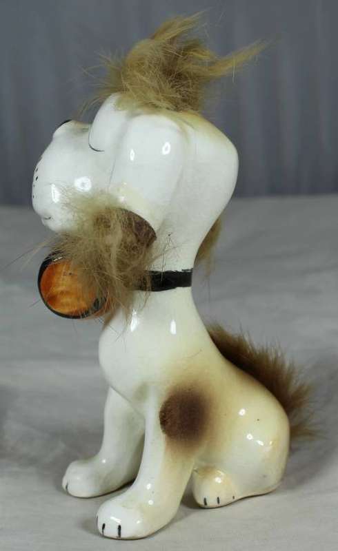 Porcelain dog with a beer keg