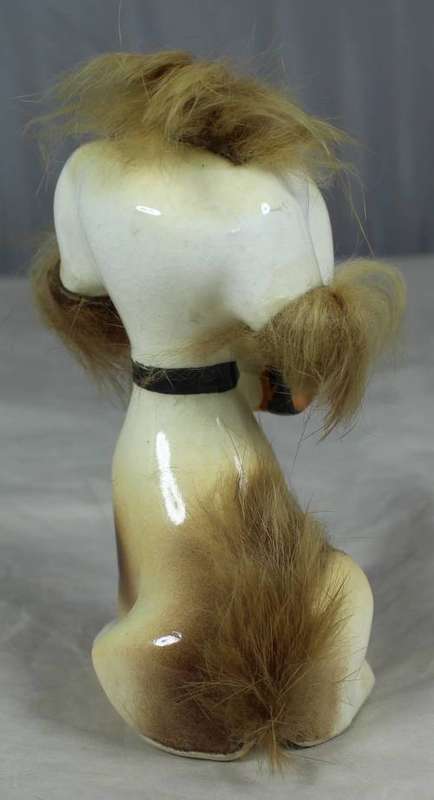 Porcelain dog with a beer keg