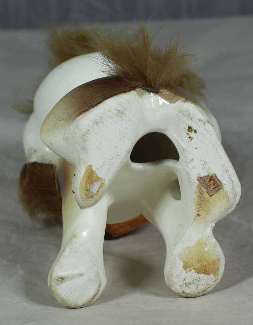 Porcelain dog with a beer keg