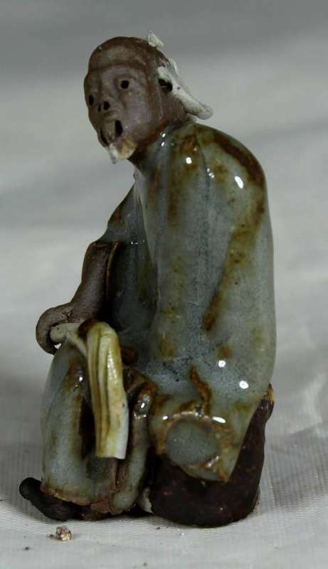 Collectible mud men - man holding a whip