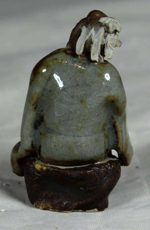 Collectible mud men - man holding a whip
