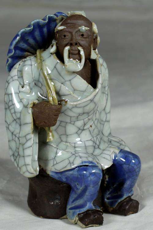 Collectable mud men - seated man with a special robe