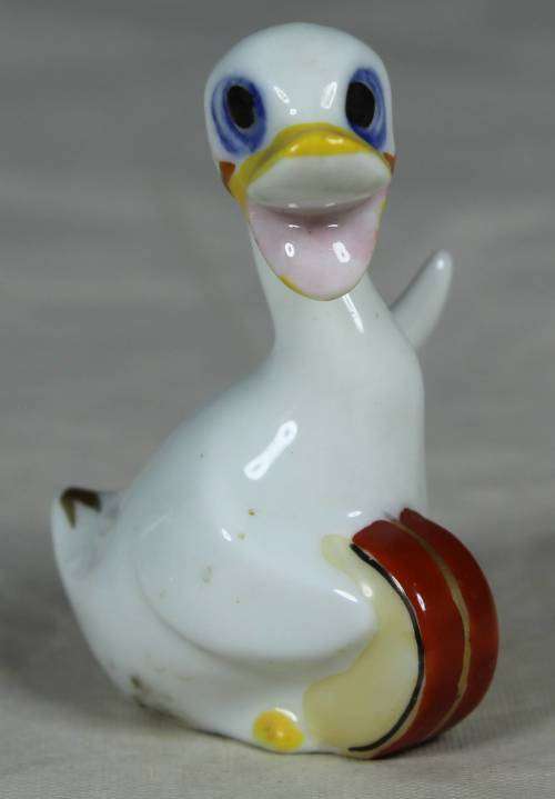 Miniature duck with a drum
