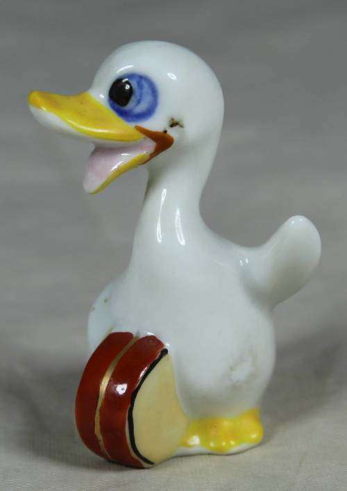 Miniature duck with a drum