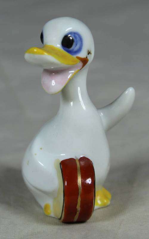 Miniature duck with a drum