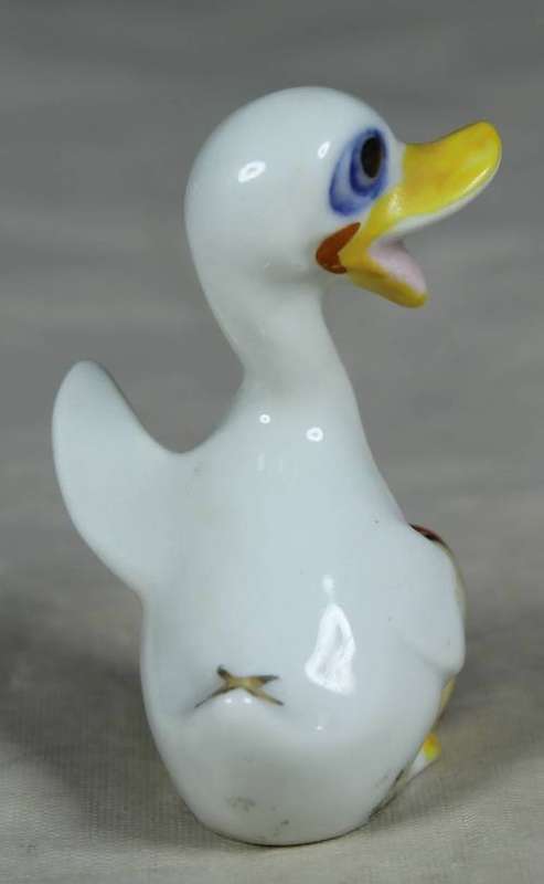 Miniature duck with a drum