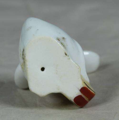 Miniature duck with a drum