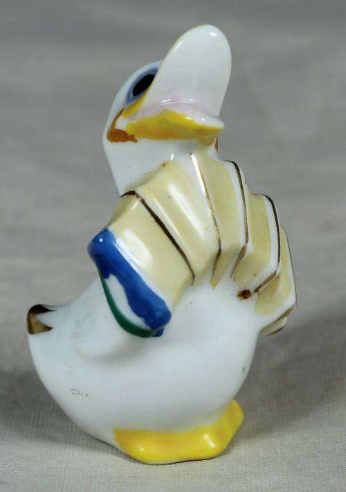 MINIATURE DUCK PLAYING A CONCERTINA(BEAUTIFUL) BID NOW !!