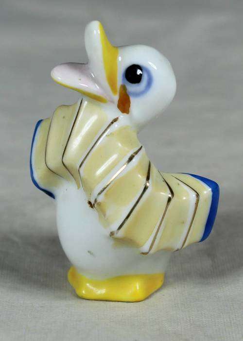 MINIATURE DUCK PLAYING A CONCERTINA(BEAUTIFUL) BID NOW !!