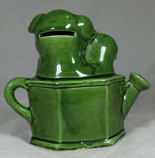 Porcelain puppies in a watering can - money box