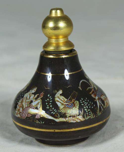 Ornate perfume container with Greek figures