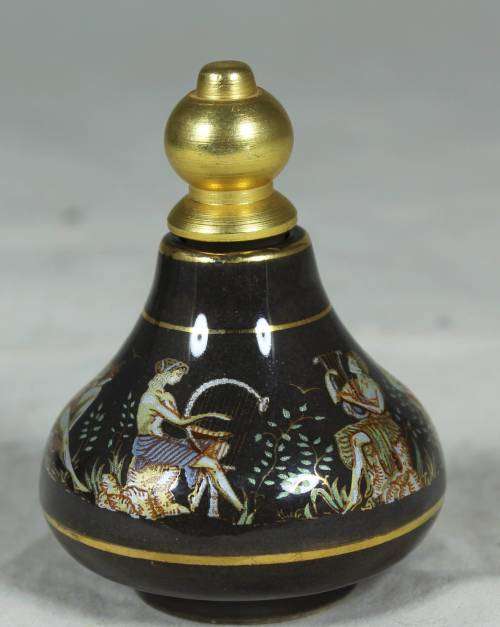 Ornate perfume container with Greek figures