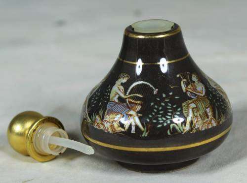 Ornate perfume container with Greek figures