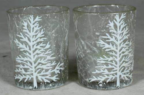Pair of decorated glasses with candles