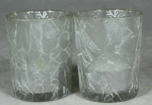 Pair of decorated glasses with candles