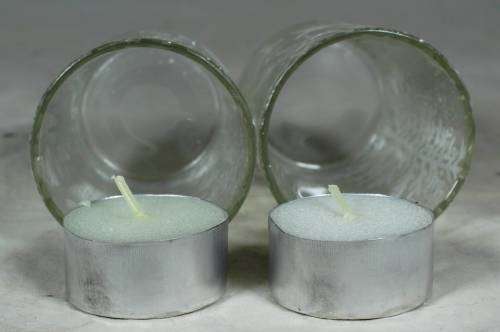 Pair of decorated glasses with candles