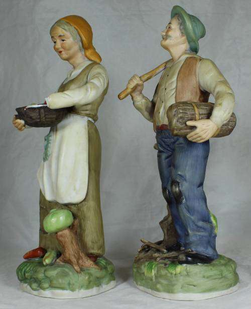 Pair of tall figurines - farmer and his wife