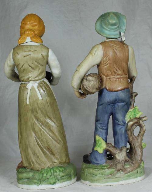 Pair of tall figurines - farmer and his wife