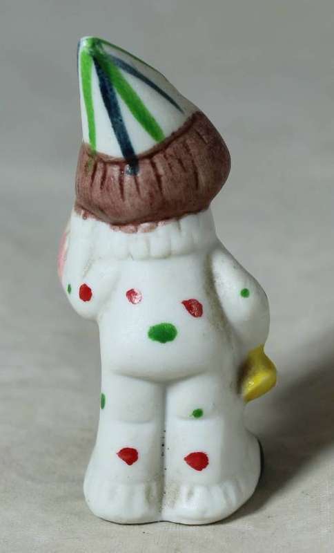 Miniature clown holding a large clock