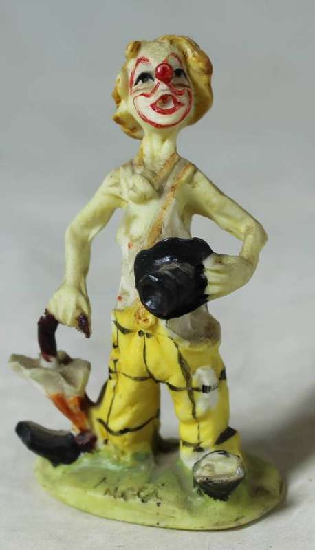 Miniature tramp with an umbrella