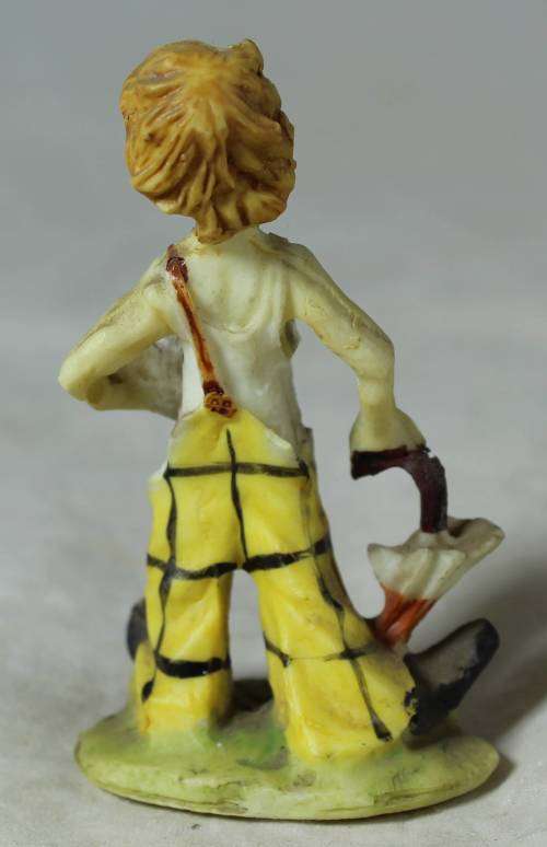 Miniature tramp with an umbrella