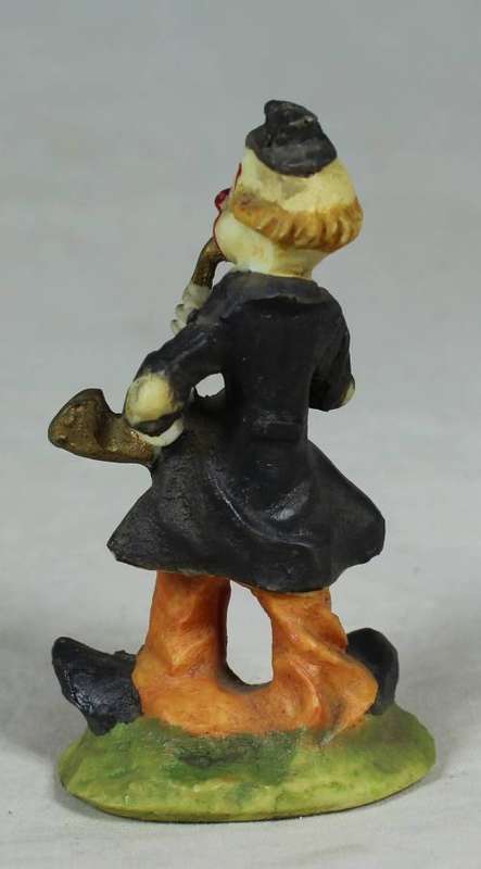 Miniature clown playing a saxophone