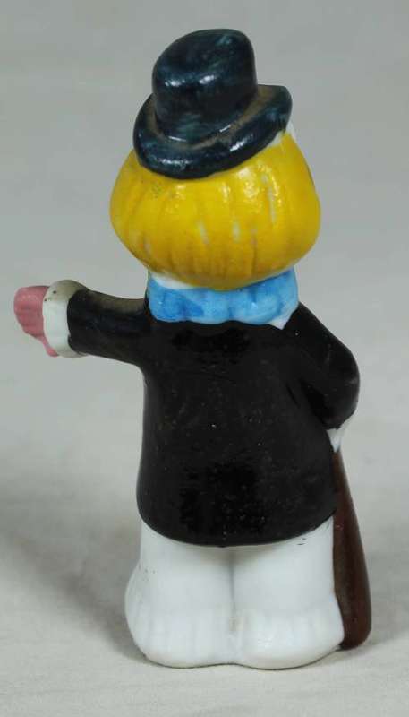 Miniature clown holding a cane