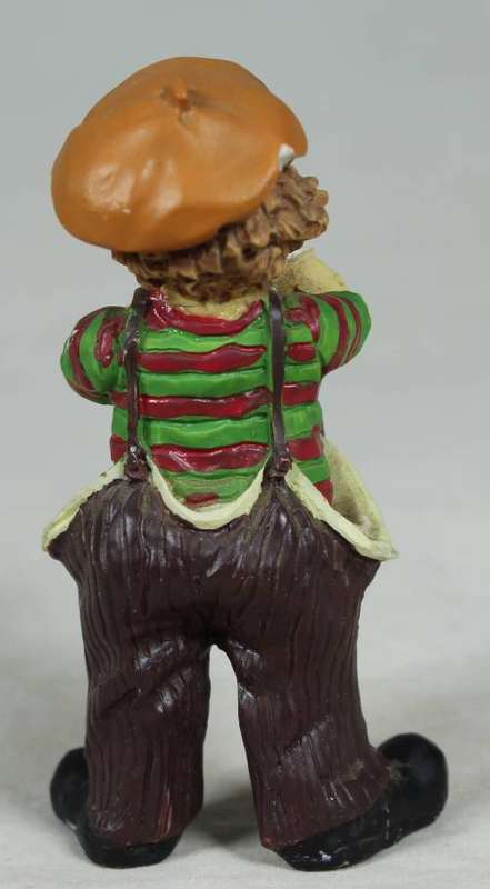 Miniature clown playing a trumpet