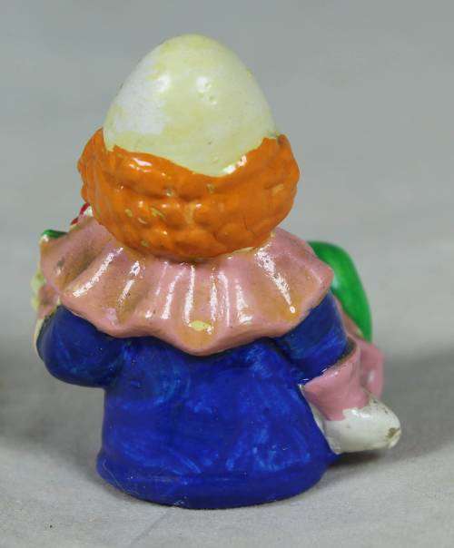 Miniature baby clown with a rattle
