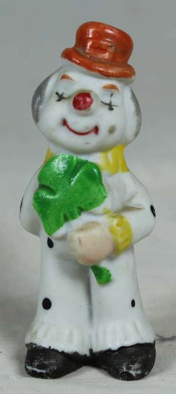 Miniature clown holding a large flower