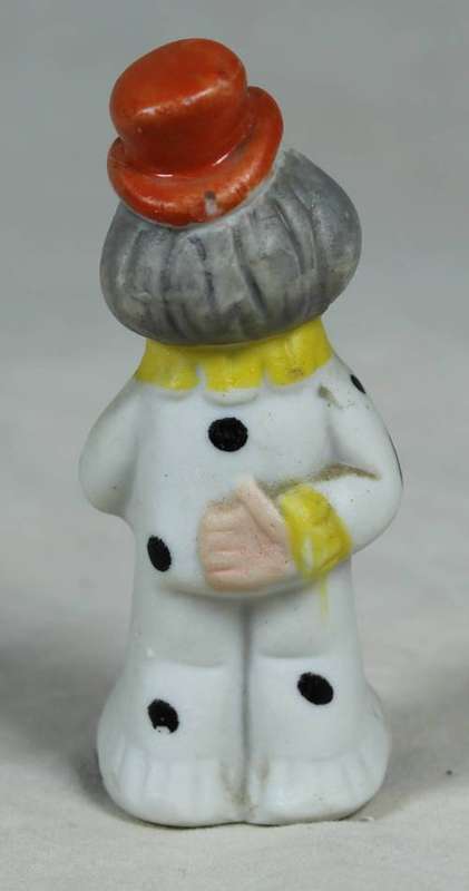 Miniature clown holding a large flower