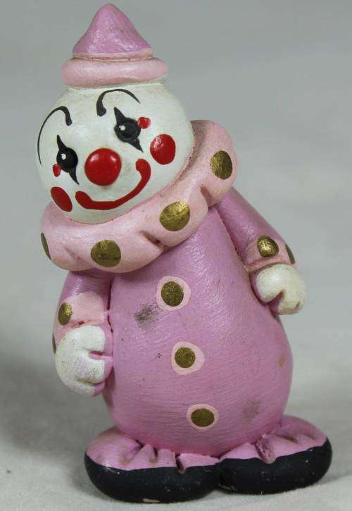 Miniature clown in pink, smiling