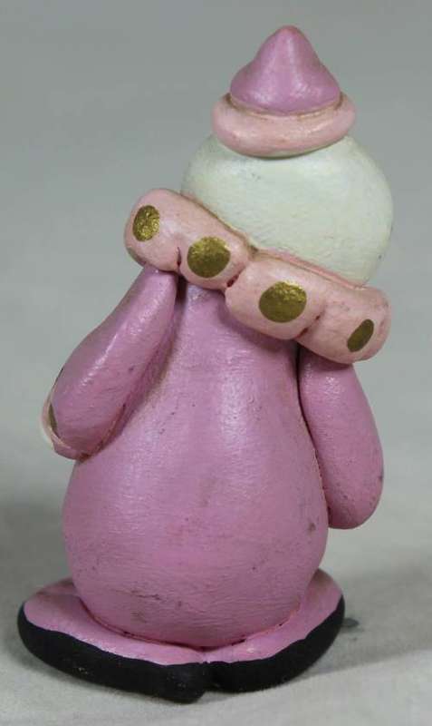 Miniature clown in pink, smiling