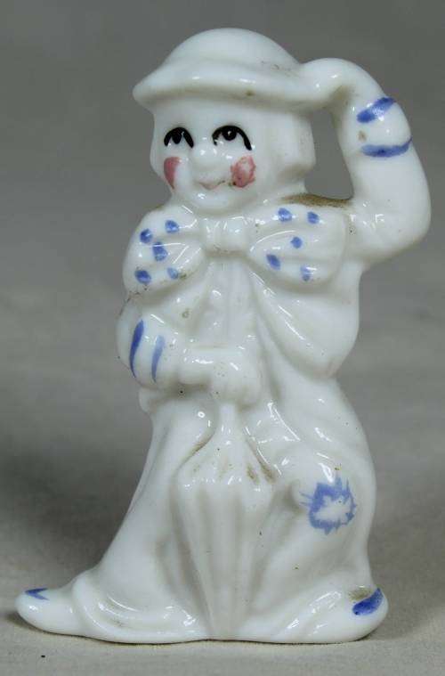 Miniature clown lady with an umbrella