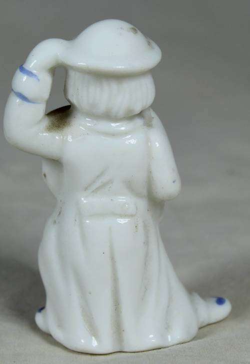 Miniature clown lady with an umbrella