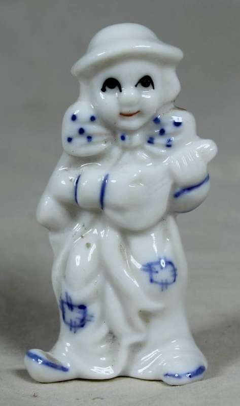 Miniature clown playing a guitar