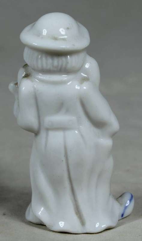 Miniature clown playing a guitar
