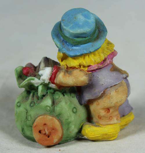 Miniature clown with a gift cart
