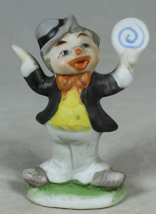 Miniature clown holding a large disk