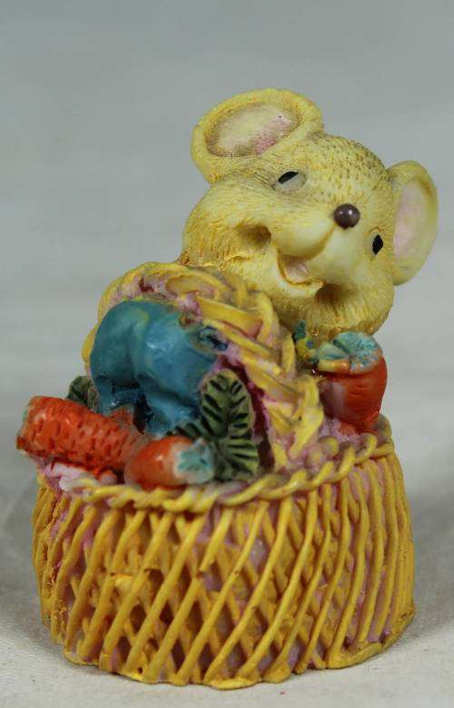 Miniature mouse in a basket