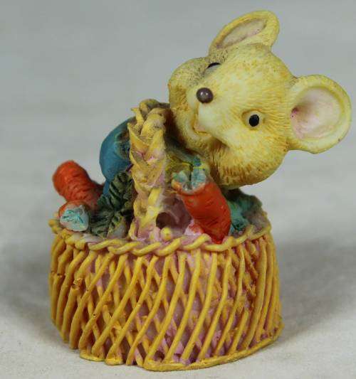 Miniature mouse in a basket