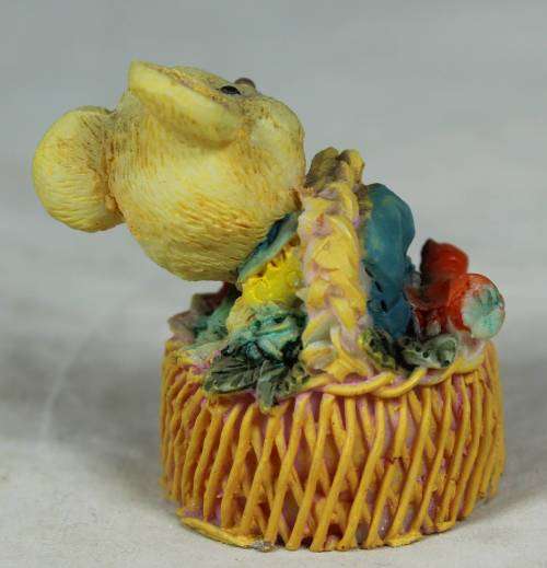 Miniature mouse in a basket