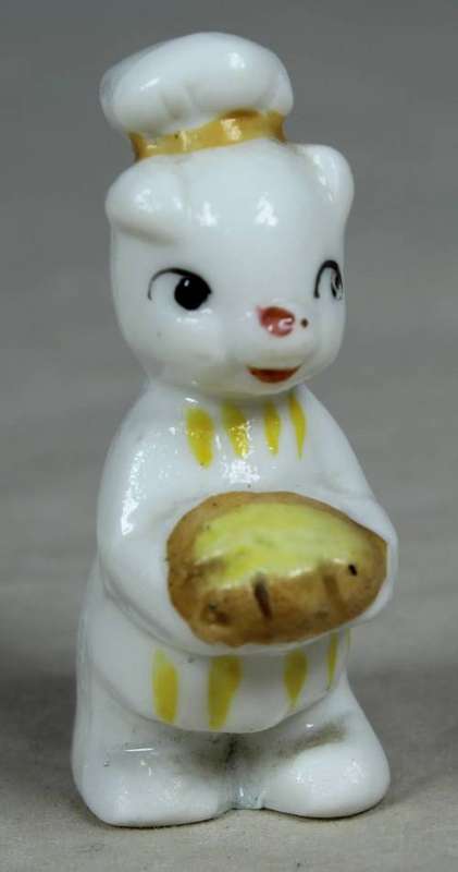 Miniature chef kitty with bread