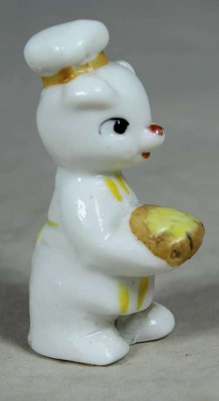 Miniature chef kitty with bread