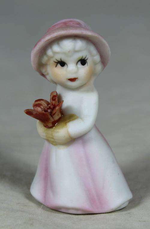 Miniature girl with flower